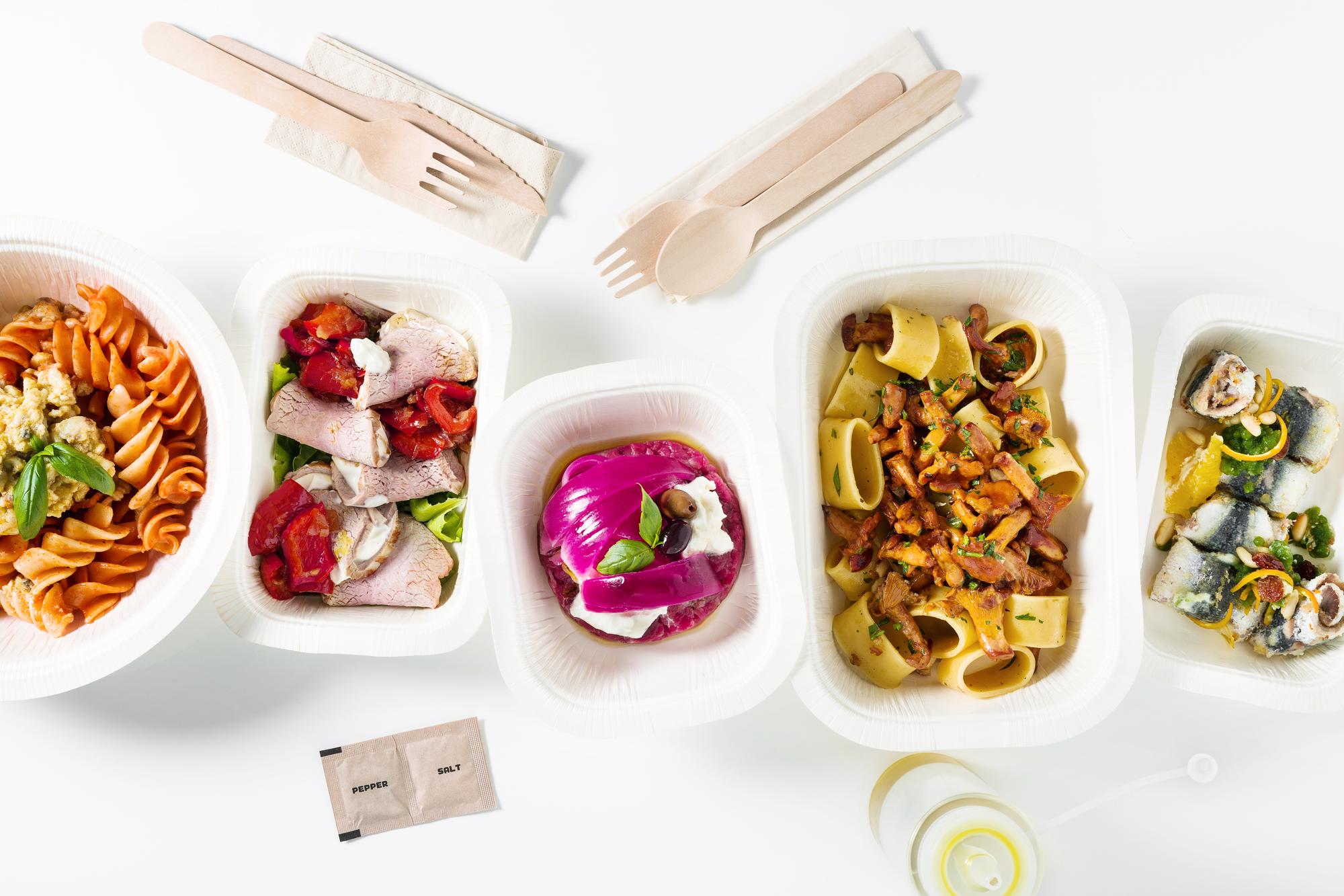 Flatlay of meal kit components and instructions